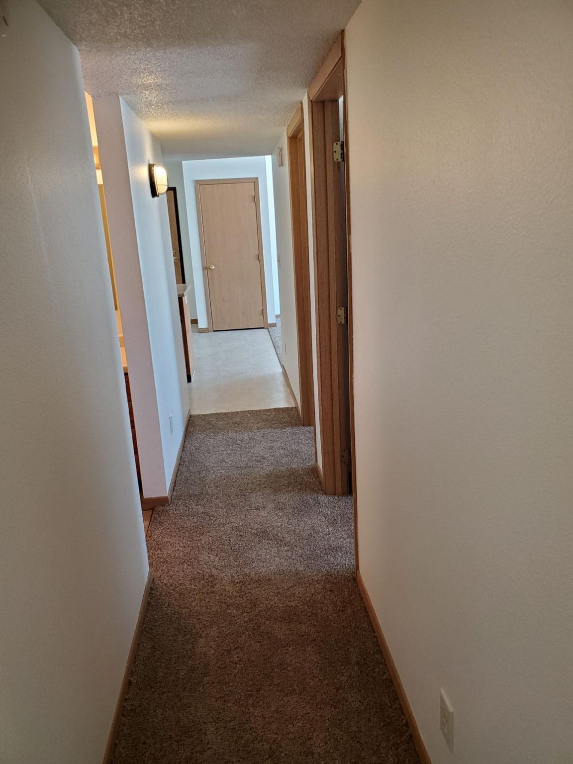 Hallway to Bedrooms Cornerstone Management