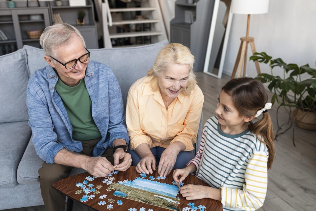 grandparents-girl-doing-puzzle-medium-shot